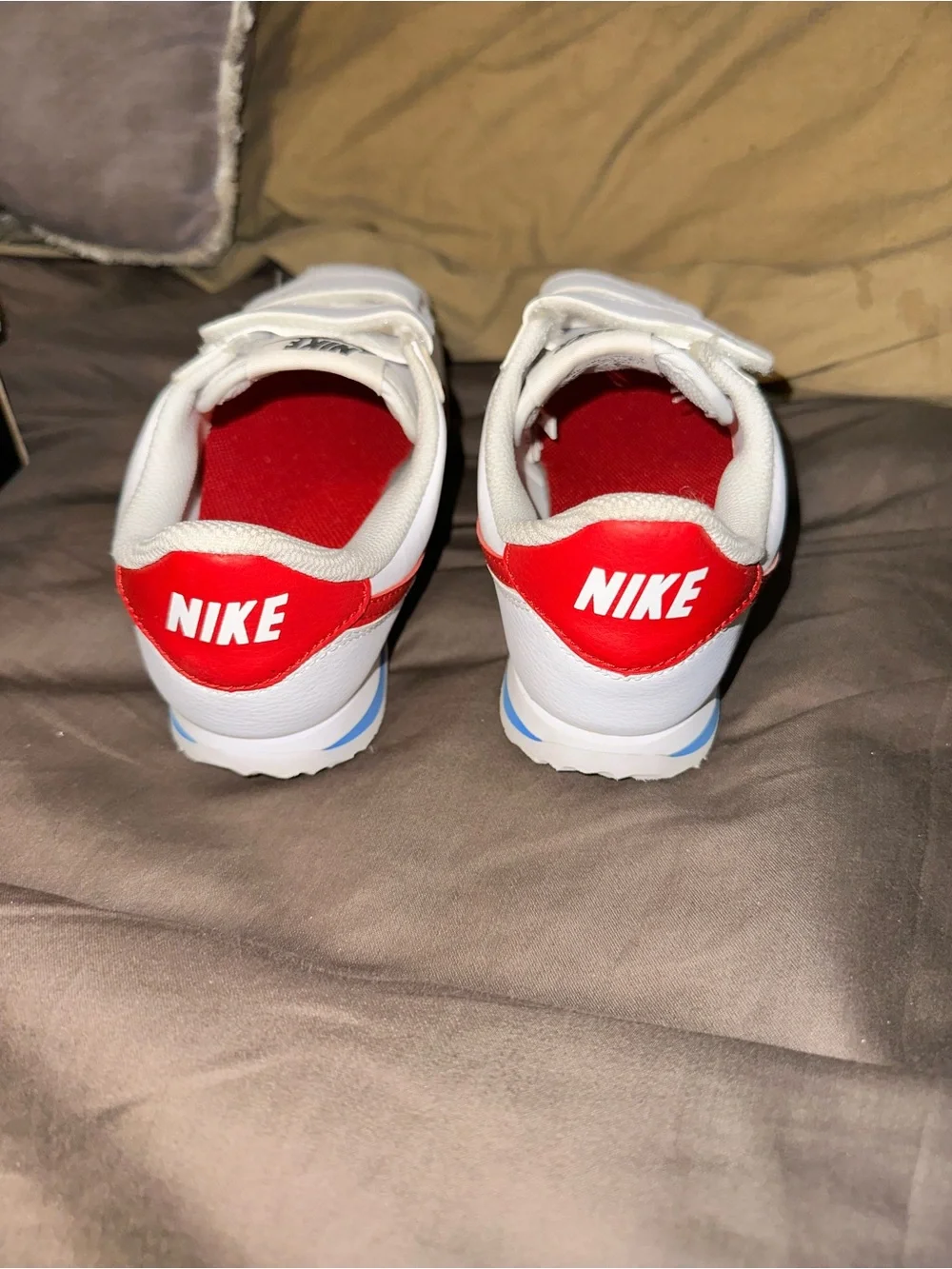 Nike Kids White Sneaker with Red Swoosh